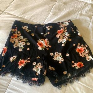 Torrid Floral Shorts with pockets and lace trim along leg. Size 2